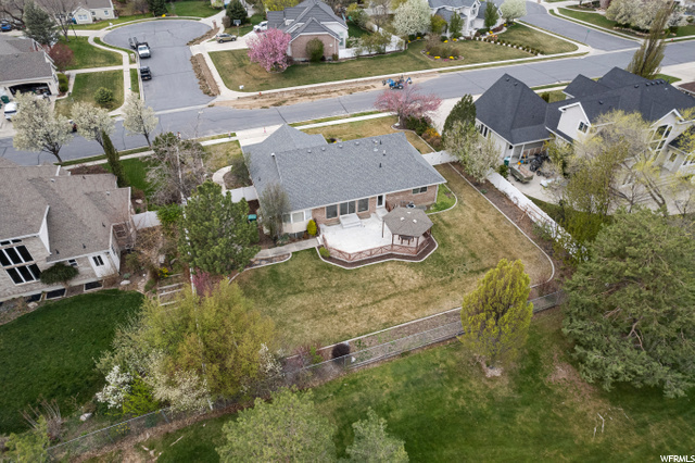 Ariel view of backyard, gazebo on large patio, and large picture windows across back of home!