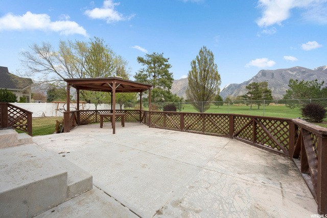 Large patio in backyard with gazebo for shade and entertaining!