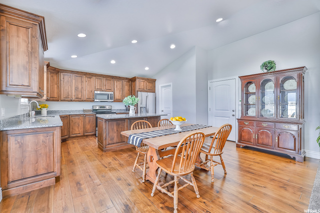Hardwood Flooring ties the Kitchen and Dining Area
