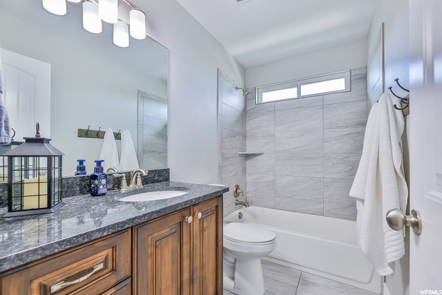 Main Bath features Adult Height Vanity & Tiled Sho