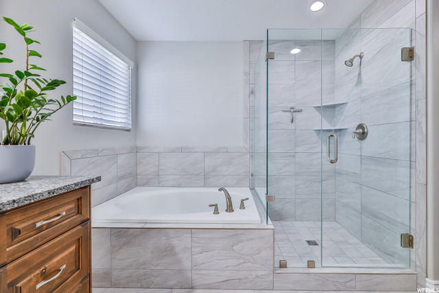 Euro Shower Door and Tile Flooring are featured in