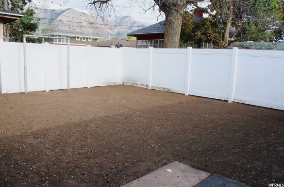 Back yard white vinyl fence