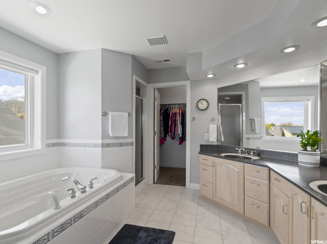 Separate tub and shower.