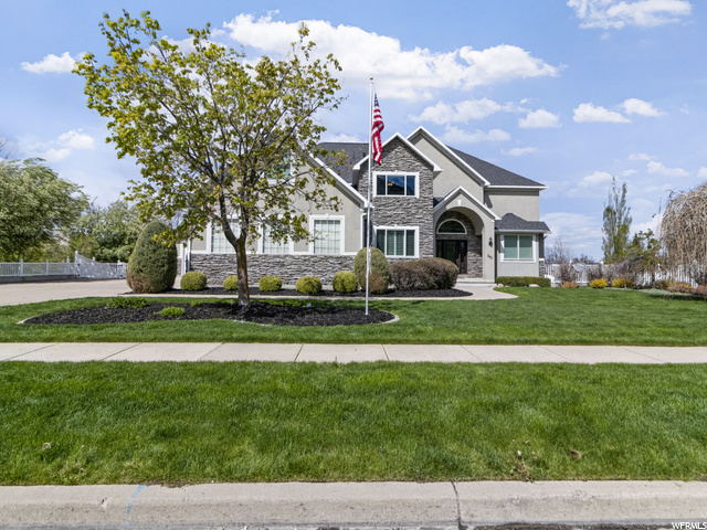 Stone and stucco home with newer roof