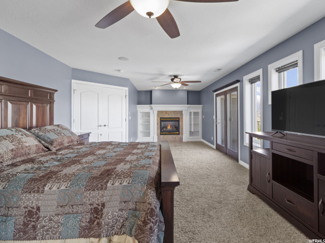 Master has a fireplace with custom shelving  and a