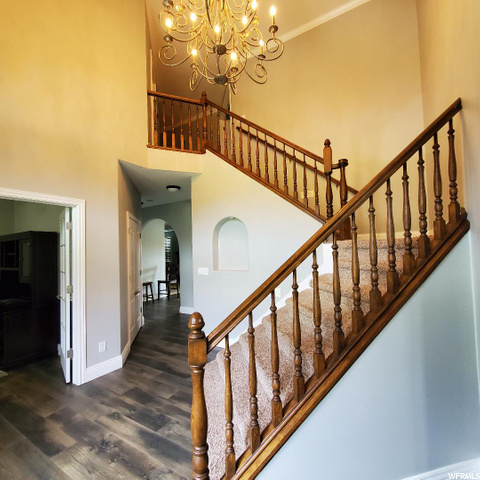 Entry staircase is one of two in the home to the u