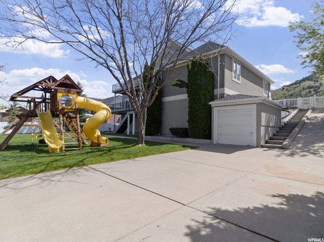 Back lower garage for yard tools and drive to uppe
