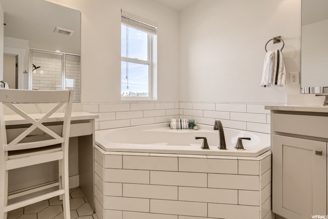Large soaker tub with separate shower