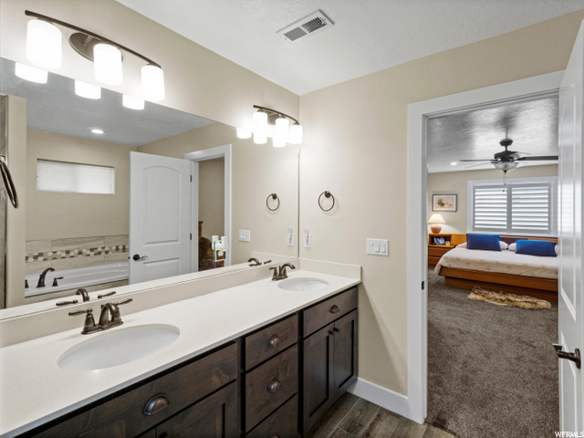 Owner's Bath with Separate Tub and Roll-in Shower