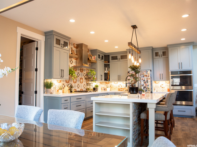 Kitchen view from dining area. Pantry to the left