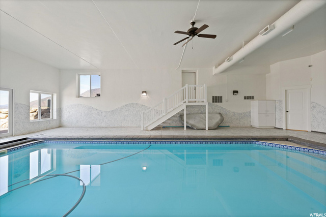 : Pool area with bathroom and shower