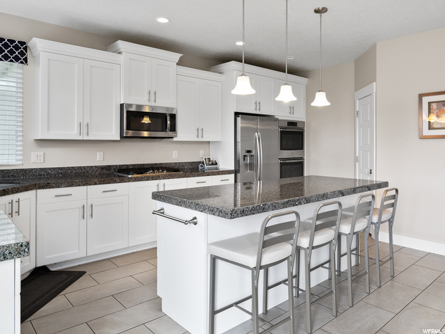 White kitchen with stainless appliances