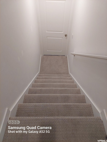 Stairs down off landing to basement entrance