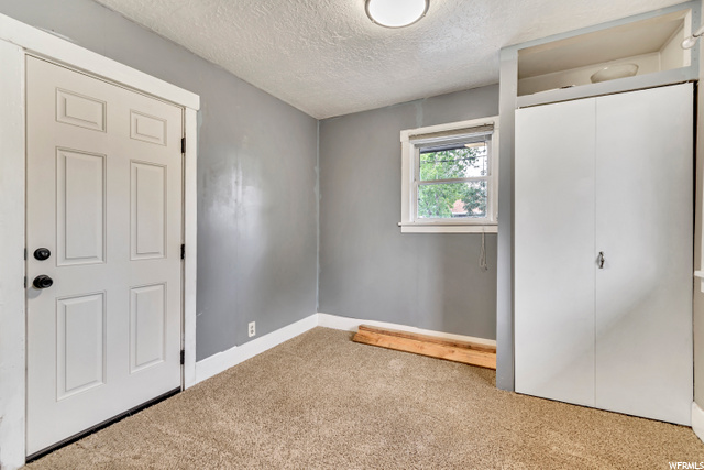 Second bedroom with a door to the patio