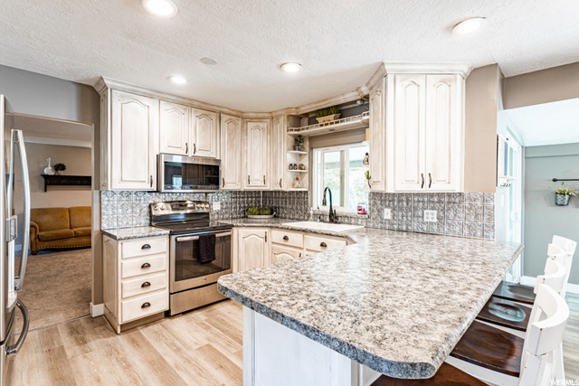 Large kitchen with stainless appliances