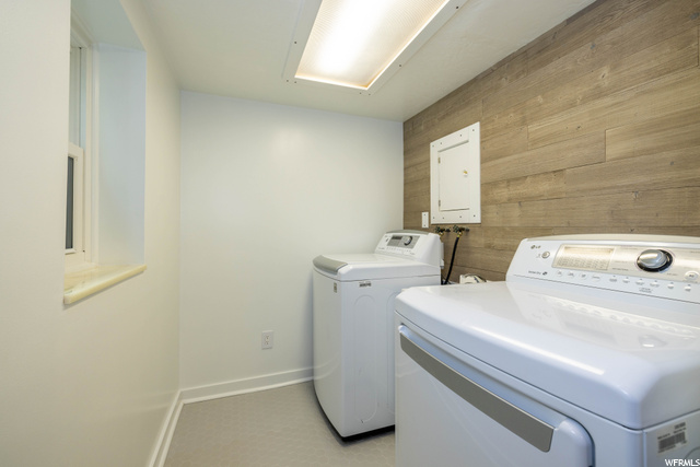 Laundry room with sink and window