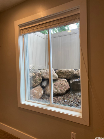 Above ground with large rock window wells
