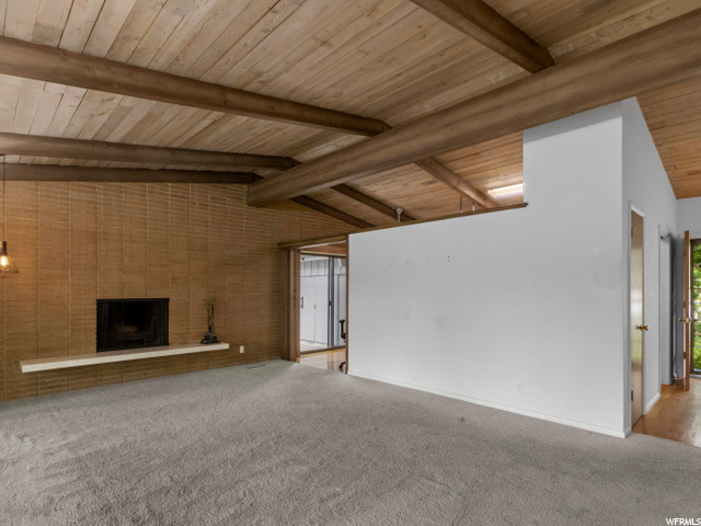 wood panels vaulted ceiling. living room up