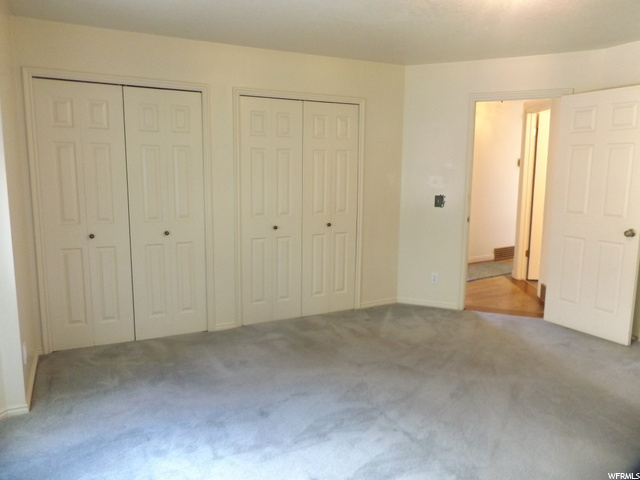 Master bedroom with his and hers closets