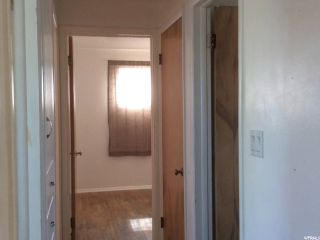 Hall with Hardwood under carpet
