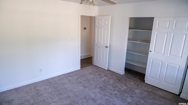Upstairs Bedroom with Custom shelving in Closet