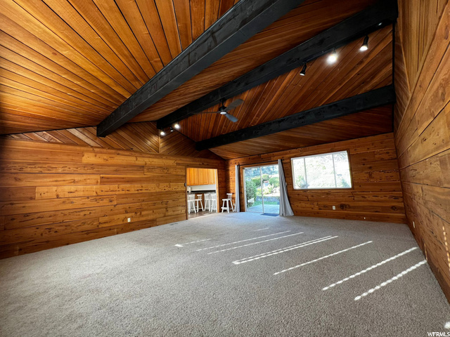 Great Room with Wood Finishes over Garage With Sli