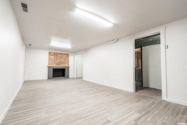 Tiled Family Room Down. Fireplace
