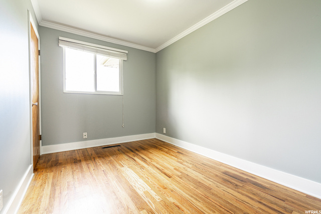 Bedroom Main With Hardwood Flooring