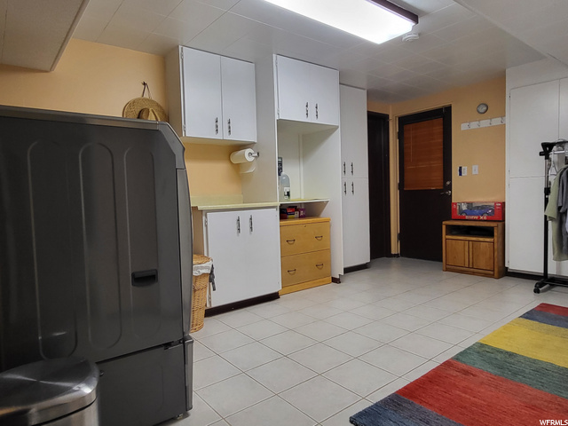 Large Laundry room with storage