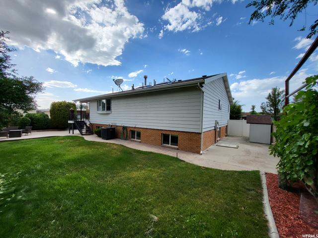 Back view of home and yard