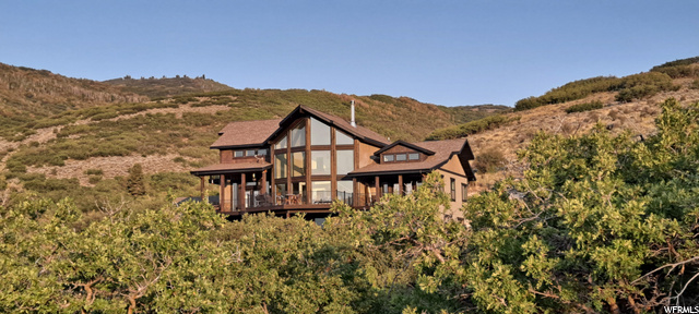 Nestled on 7.23 acres: Soak in the quite solitude this home is at the top of a private canyon.