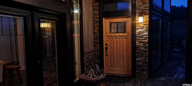 Main entrance: Exterior of home includes, slate rock, 12x1