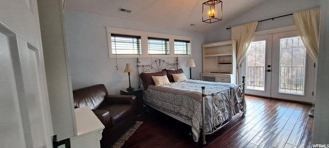 Spacious bed room which includes, Brazilian Mahogany floors, leaded glass French doors that lead to it's private deck.