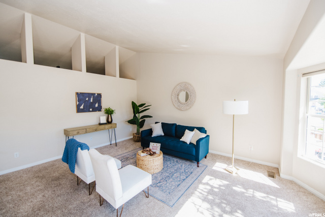 Living Room Has Lighted Shelf Ledge