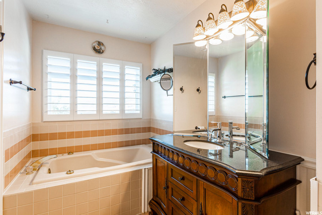 Owners bath with separate tub/shower.