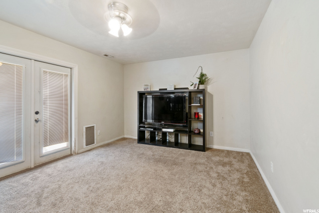 family room off garage & backyard