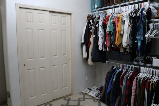 Bedroom being used as extra closet space