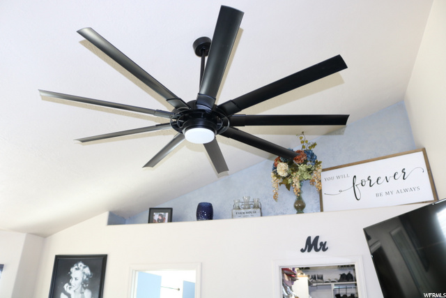 large ceiling fan in primary bedroom