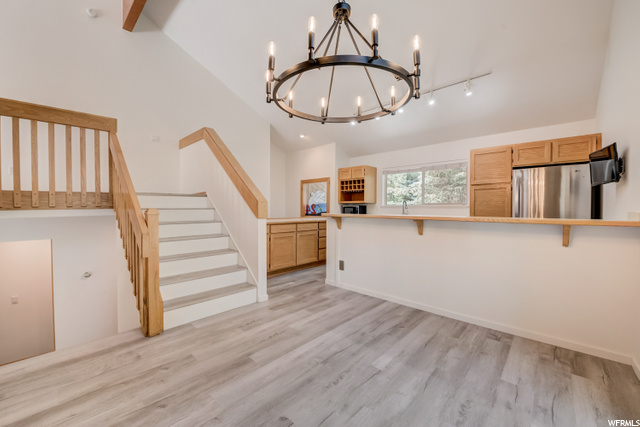 Open floor plan with vaulted ceilings