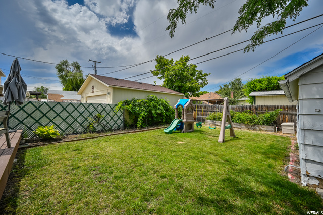 Backyard. Swing set is staying!
