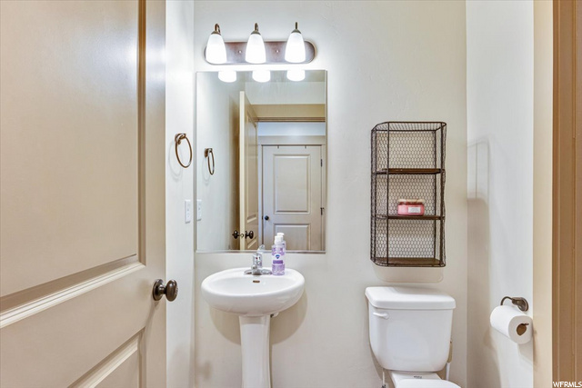 Half Bathroom Downstairs Adjacent to Laundry Room