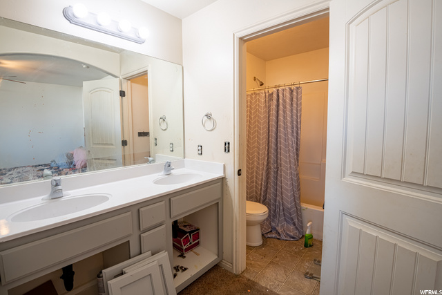 Master bath with a walk in closet