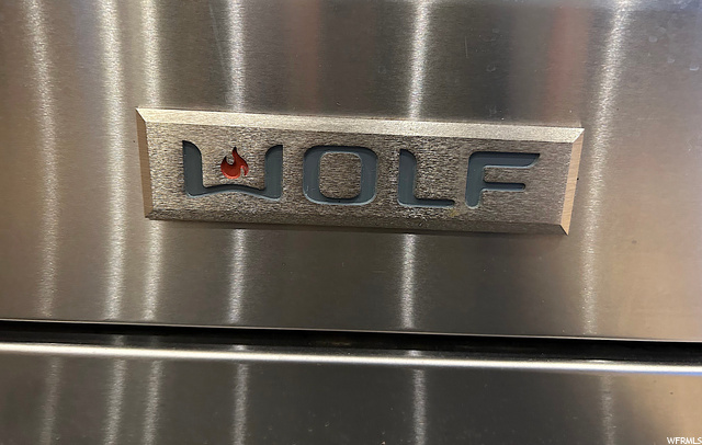 Wolf Range with double oven, 6 burners and a griddle.