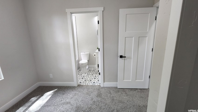 This bedroom has a door to the bathroom