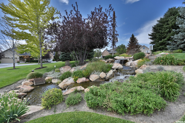 A lovely waterfall greets you as you pull into the complex. This grassy common space is just a few steps from the front door.