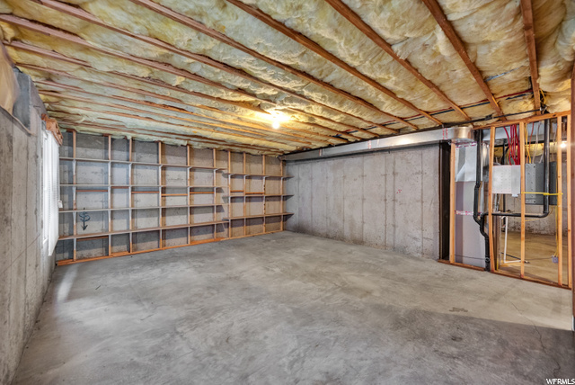 Wall shelving and plenty of open space for storage.