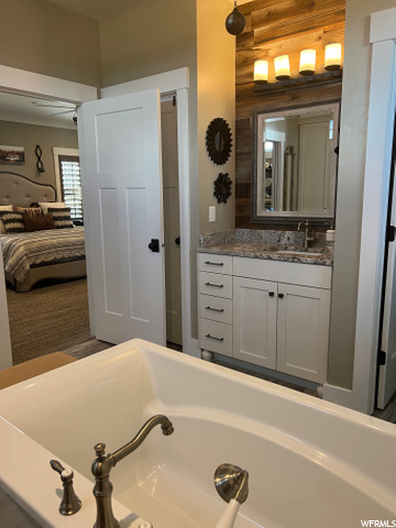 Master Bath entry to his closet