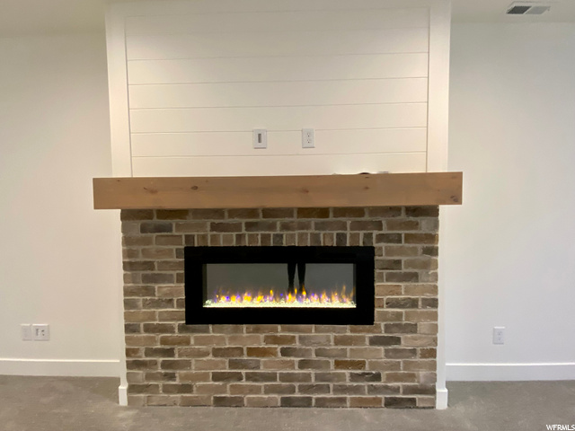 Actual Basement Fireplace: Brick Surround, Stained Mantle, Shiplap Detailing Above