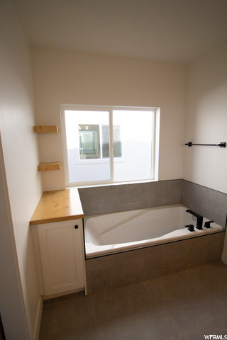 bathroom with a tub