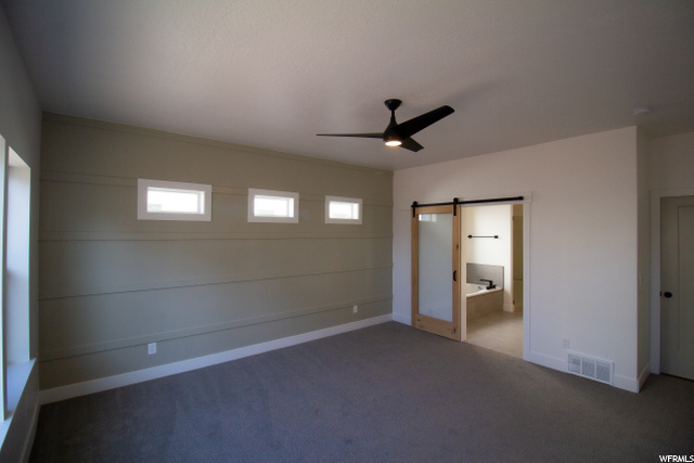 carpeted bedroom featuring a ceiling fan